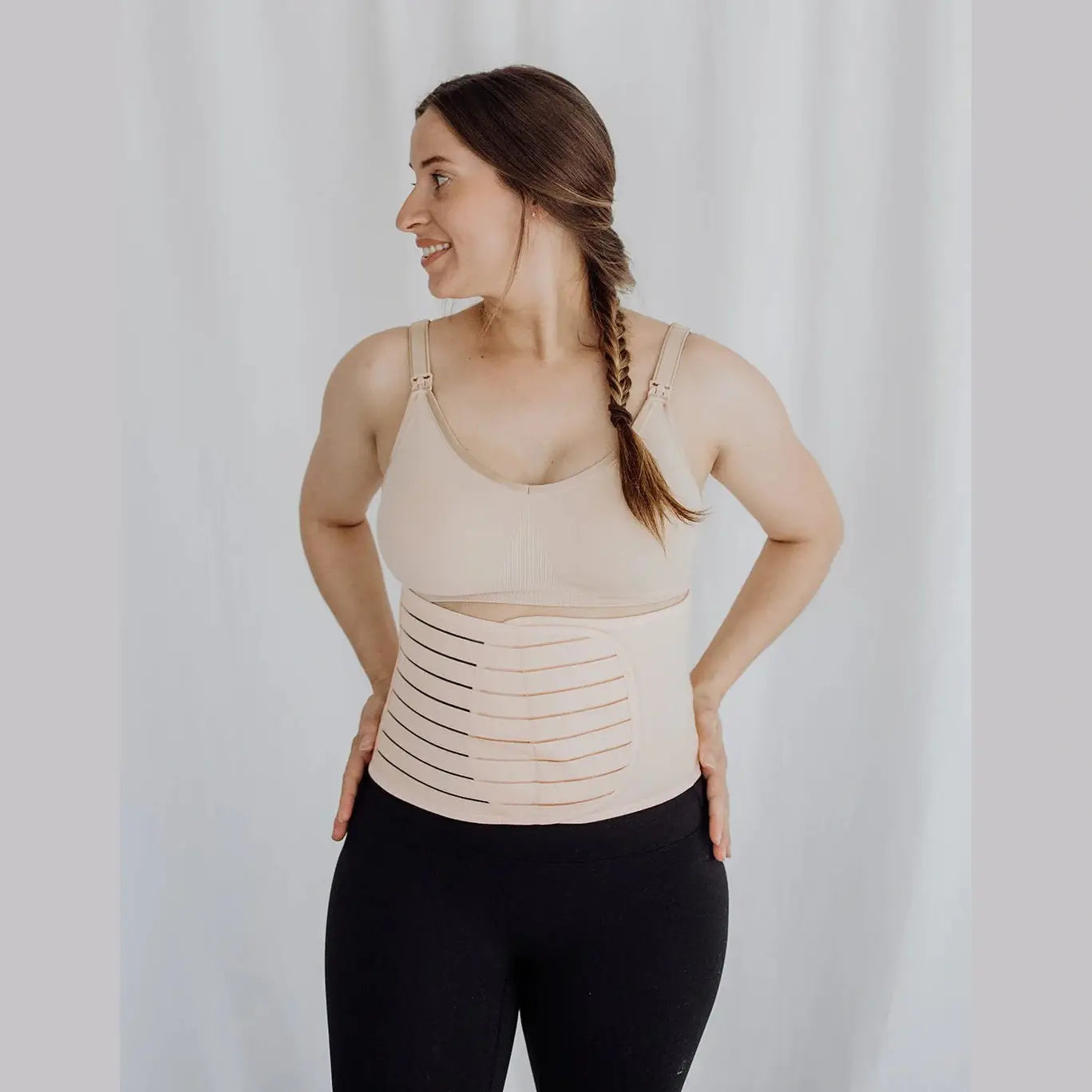 Women wearing postpartum belly band around waist